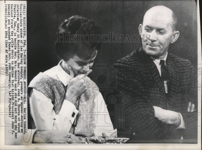 Load image into Gallery viewer, 1964 Press Photo Mrs Marina Oswald Ponders Answer During Interview Today in WA
