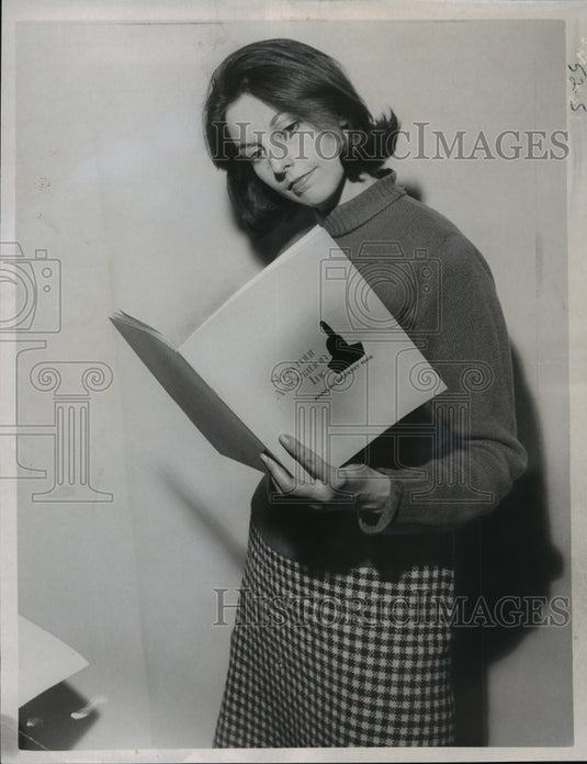1969 Press Photo Boston press photographer Teresa Zabala holding annual report