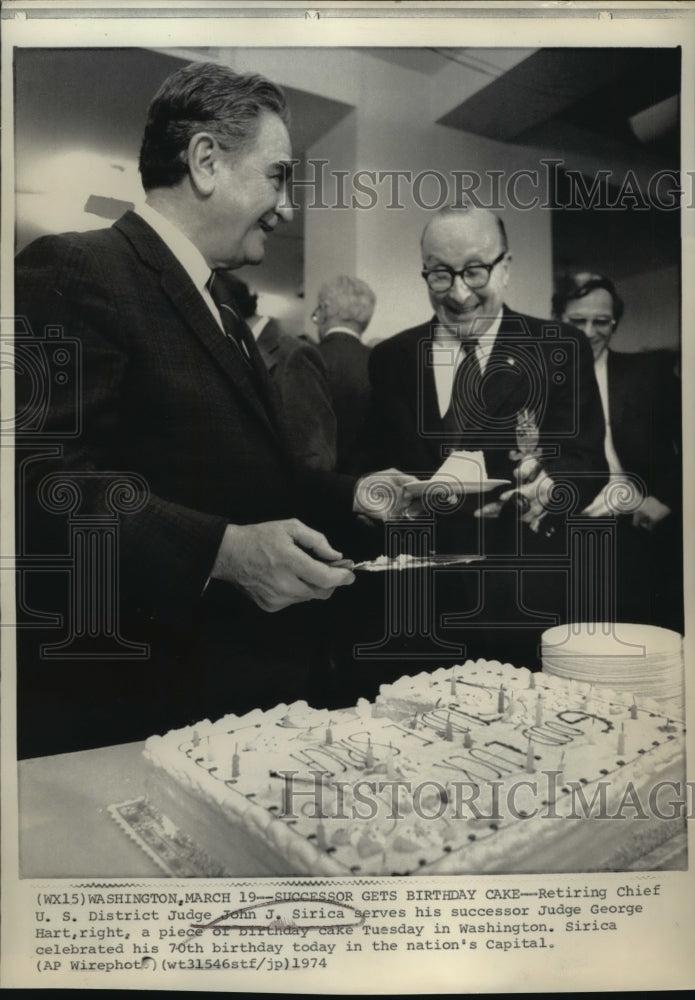 1974 Press Photo John J. Sirica serves his successor a piece of birthday cake