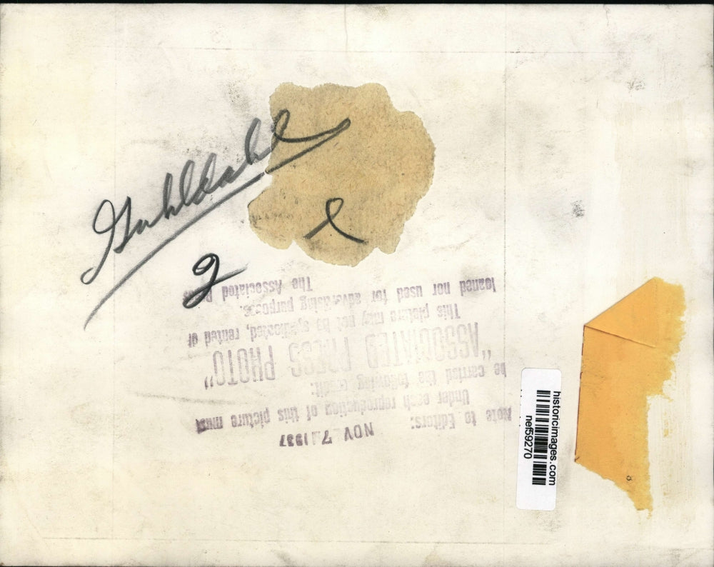 1937 Press Photo Woman comforts husband in hospital bed - nef59270