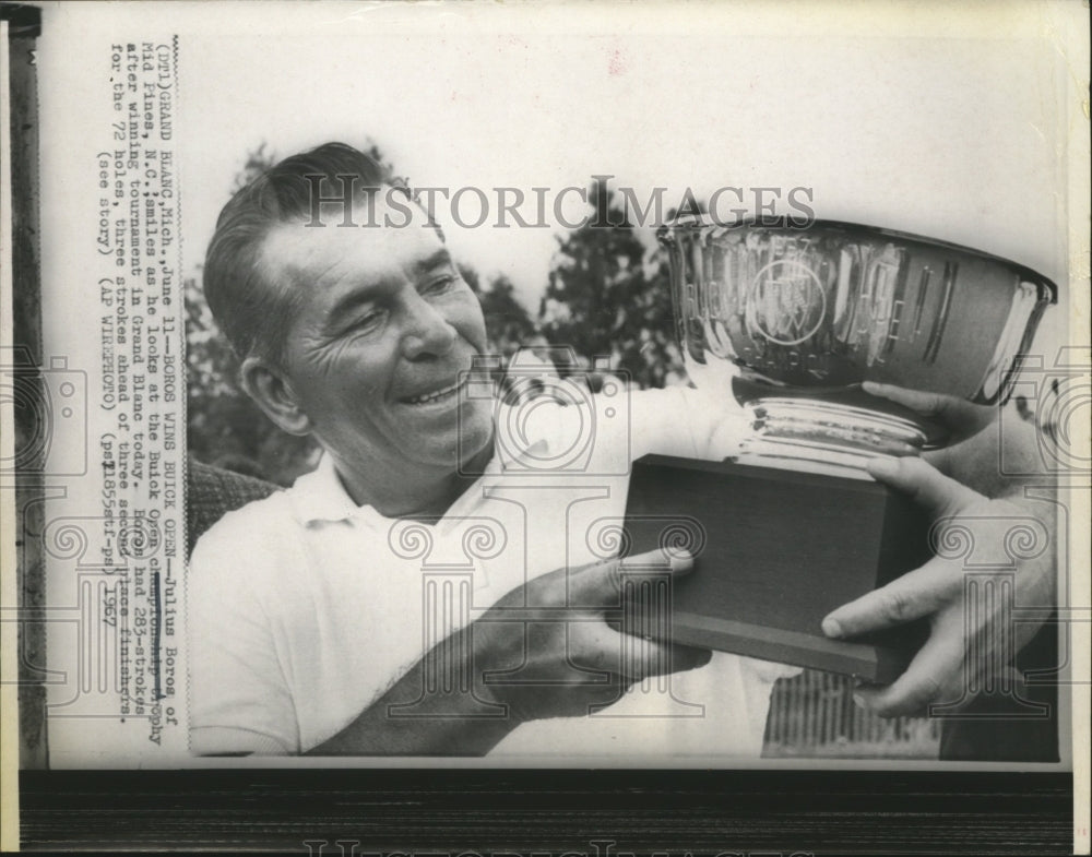1967 Press Photo Julius Boros look at the Buick Open Championship Trophy