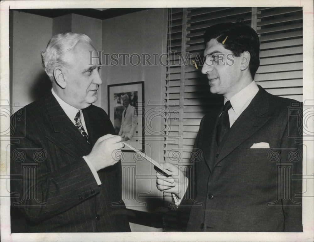 1945 Press Photo Christian Valensi presents check to Leo T. Crowley - nef59876