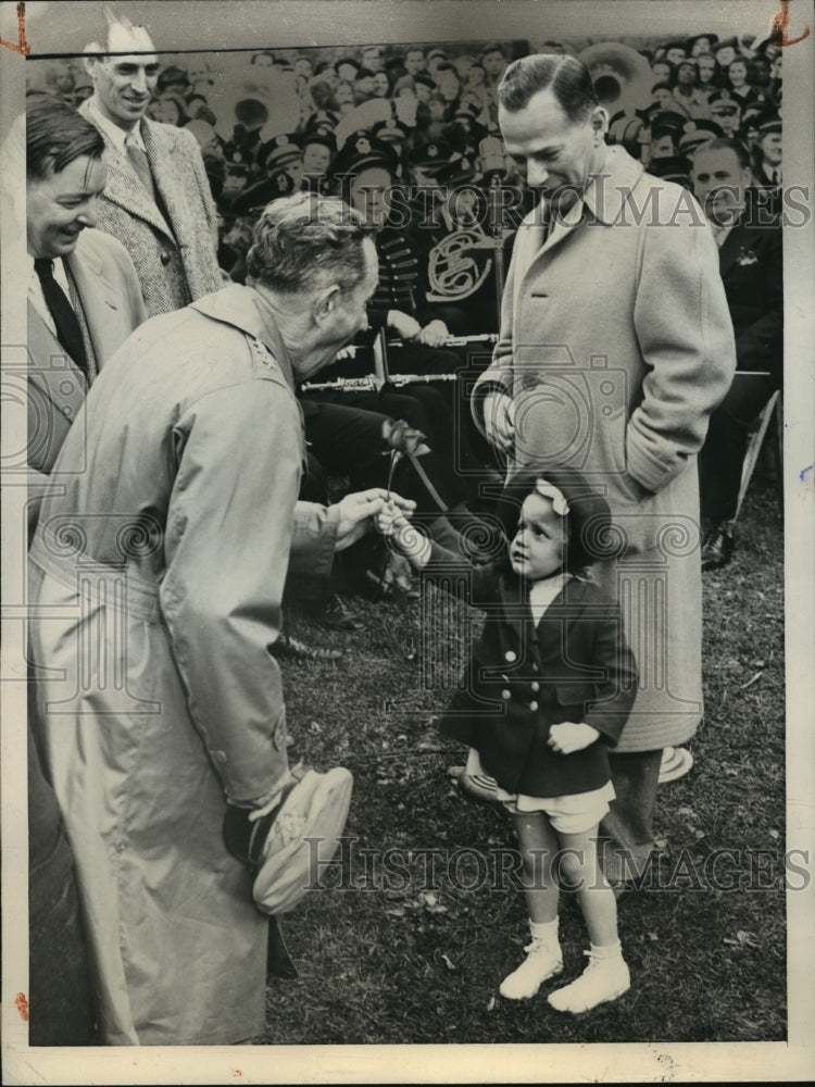 1945 Press Photo Raymond A. Wheeler receives rose from a young admirer- Historic Images