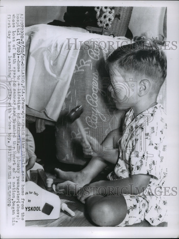 1956 Press Photo Mike Sibole learning to play with new toys with blindness
