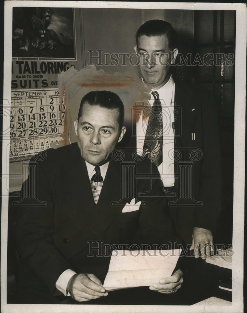 1949 Press Photo Michael Blackwell and John Fitzgerald at desk - nef62440- Historic Images