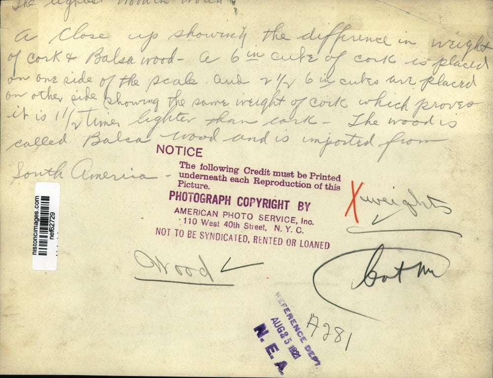 1921 Press Photo Closeup showing difference in weight of cork and balsa wood