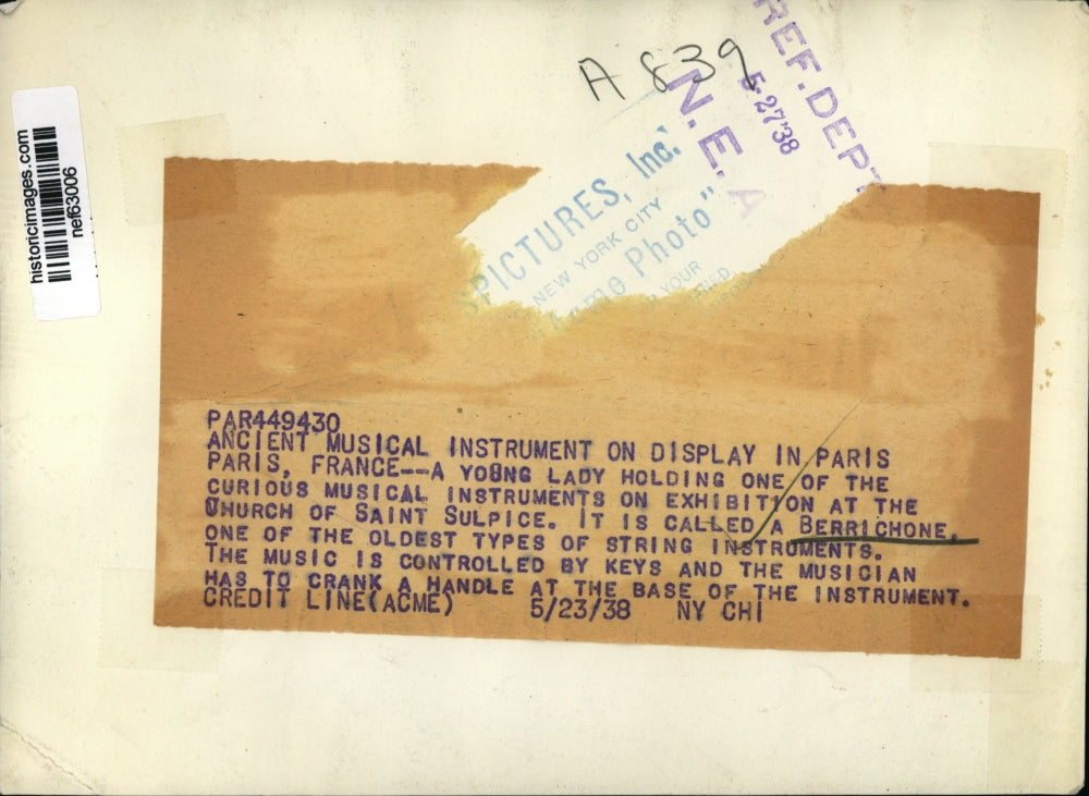 1938 Press Photo Girl with Berrichone at Church of Saint Sulpice, Paris, France