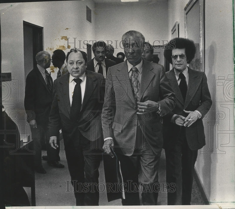 Load image into Gallery viewer, 1973 Press Photo Ralph H. Metcalfe leaving police form session with mayor
