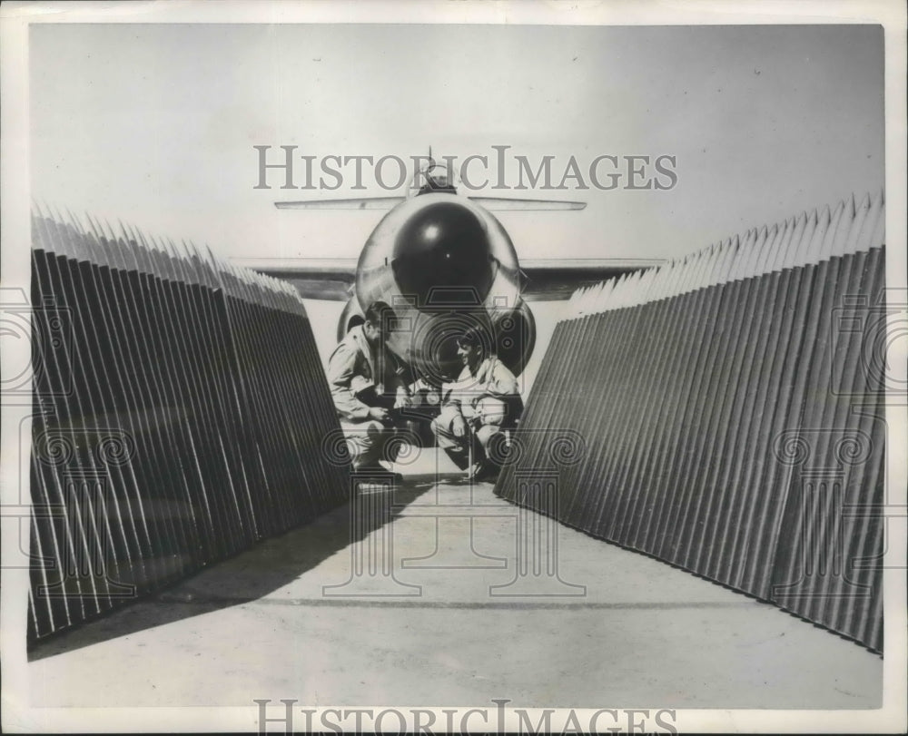 1953 Press Photo interceptor rockets lined up next to Scorpion F-890 jet