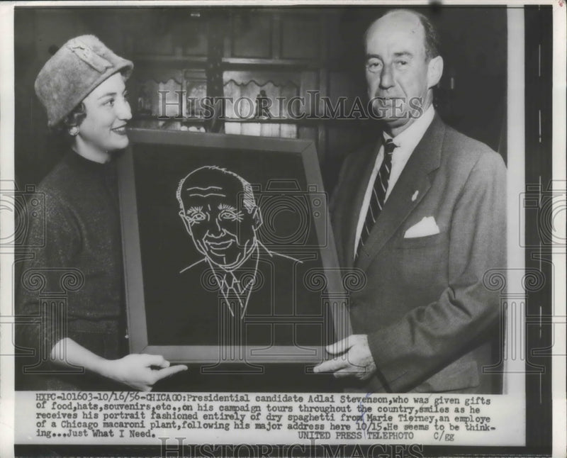Load image into Gallery viewer, 1956 Press Photo Adlai Stevenson Receiving Spaghetti Portrait from Marie Tierney
