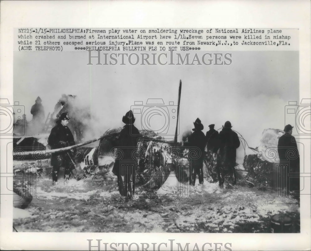 1951 Press Photo Firemen Place Water on Wreckage of National Airlines Plane