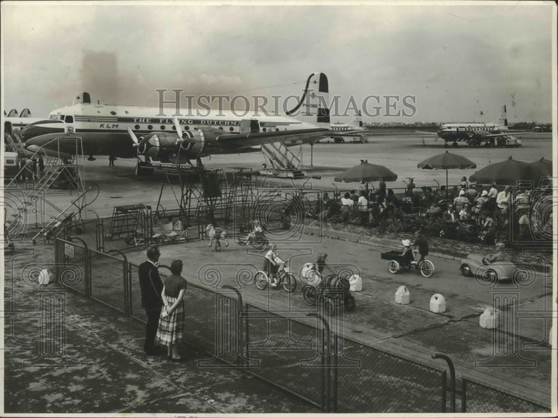 Load image into Gallery viewer, 1955 Press Photo Bicyclists Amusing Themselves While Parents Watch Traffic
