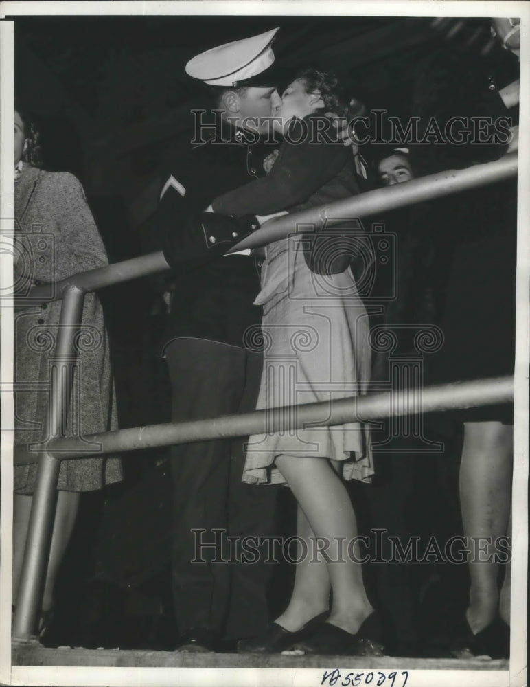 Load image into Gallery viewer, 1940 Press Photo Waiting for Shore Patrol Boat to Take Him Back to His Ship
