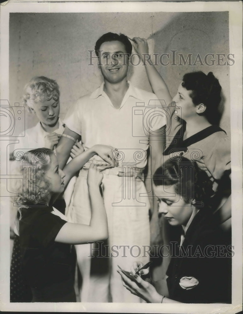 1935 Press Photo Jimmie Natarro Gets Measurements Taken By Valerie Traxler