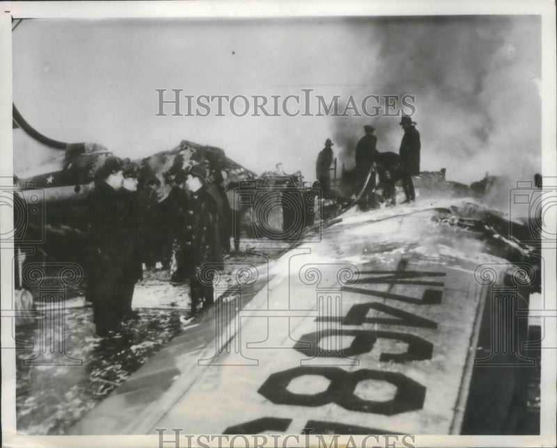 Load image into Gallery viewer, 1951 Press Photo Firemen pour water Natl. Airlines DC-4 crashed in Snowstorn
