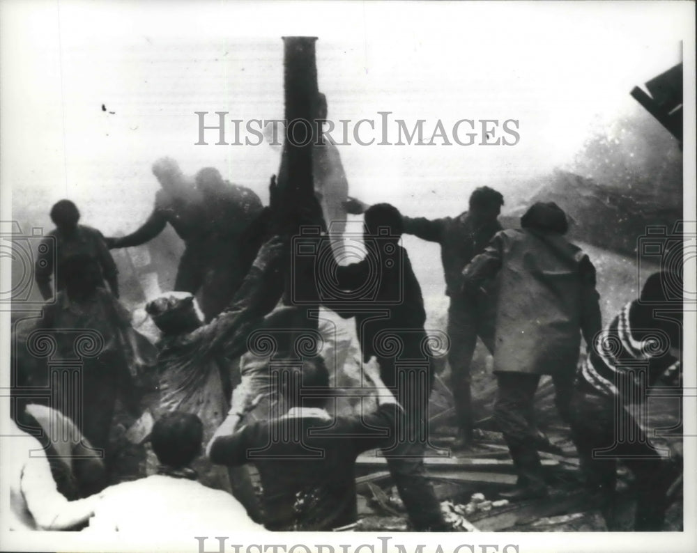 1963 Press Photo Rescuers life piece of wreckage of U.S Navy Skyhawk Jet Fighter