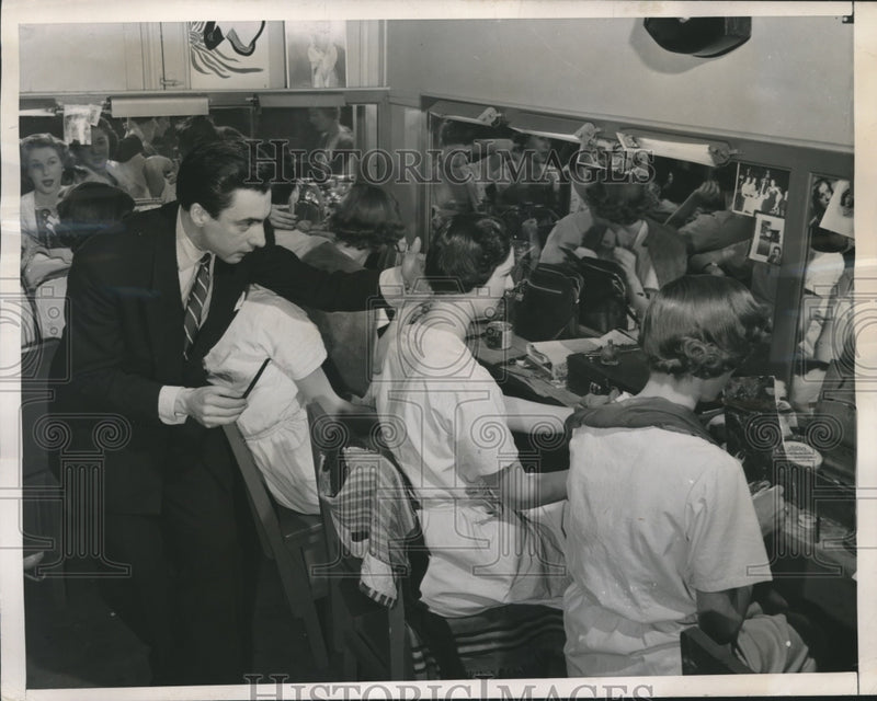 Load image into Gallery viewer, 1949 Press Photo Hairdresser Serge Simon Checks the Latest Paris Hairdos
