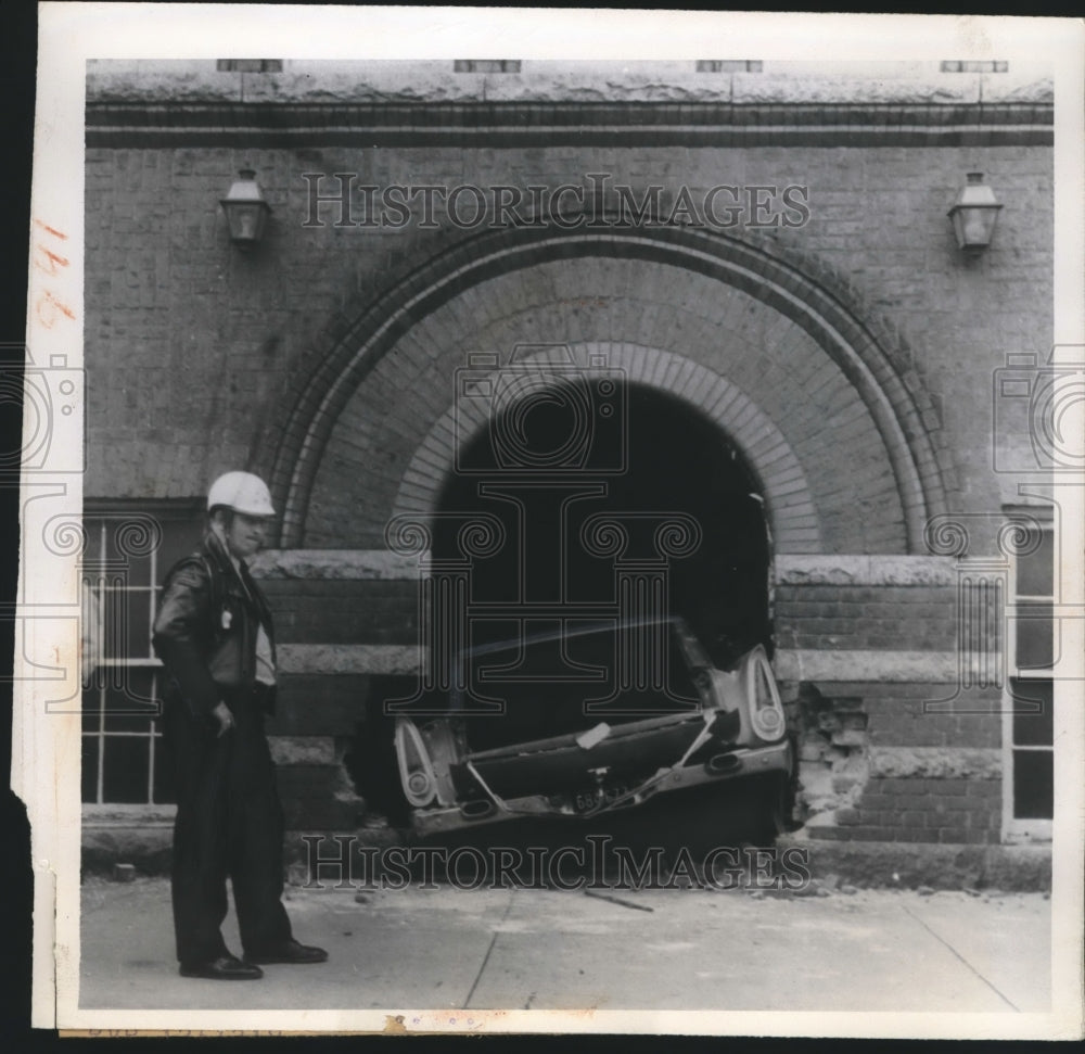 1960 Press Photo Motorcycle Patrolman H. H. Moyton Inspects the Damage at Church