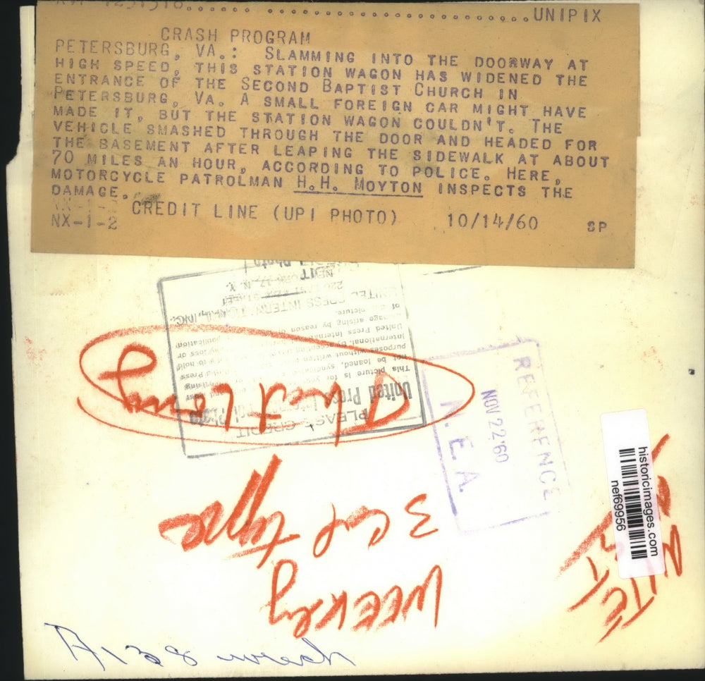 1960 Press Photo Motorcycle Patrolman H. H. Moyton Inspects the Damage at Church