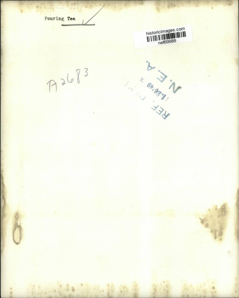 1949 Press Photo Beautiful Woman Pouring Tea For a Handsome Man - nef69988