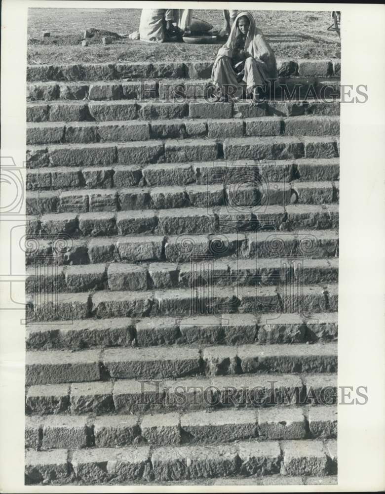 1970 Press Photo Woman sits on steps in New Delhi, India - nef72143- Historic Images