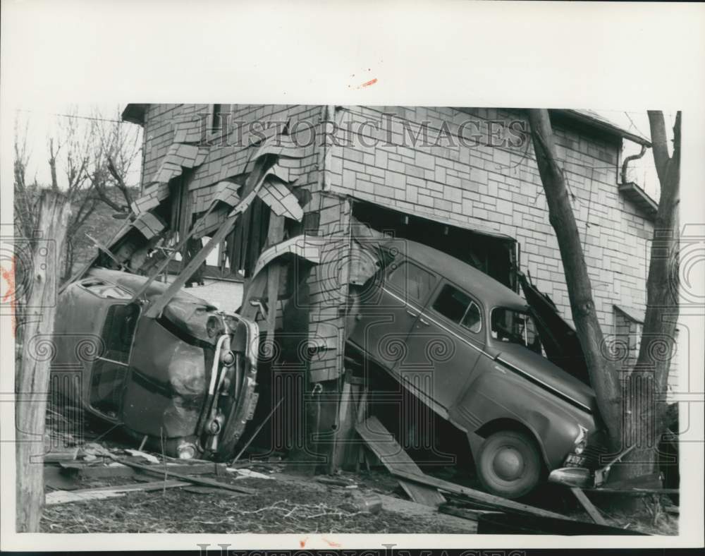 1959 Press Photo Two Autos Crash Through Building One Stopped by Tree