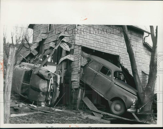 1959 Press Photo Two Autos Crash Through Building One Stopped by Tree