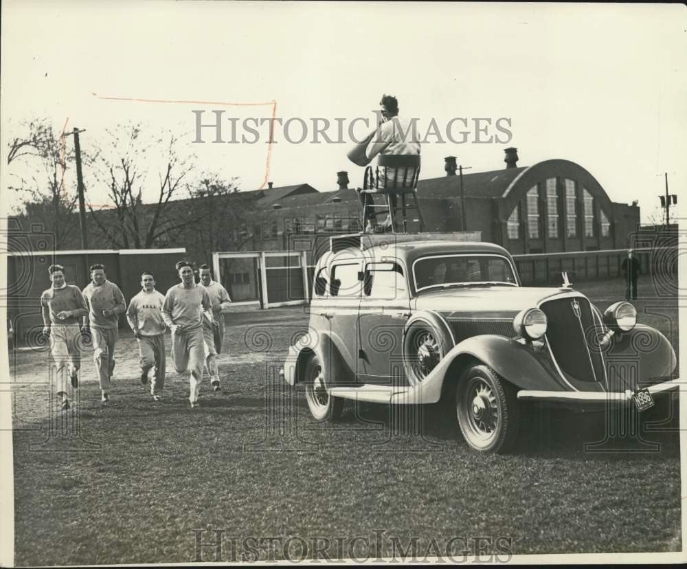 1934 Press Photo John Nicholson Coaches Team From Atop Automobile at Notre Dame- Historic Images