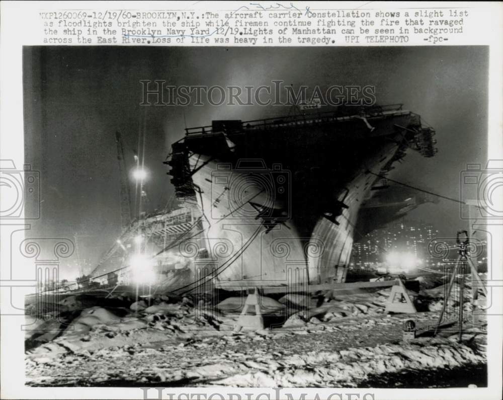 1960 Press Photo Aircraft carrier Constellation lists as firemen battle fire, NY