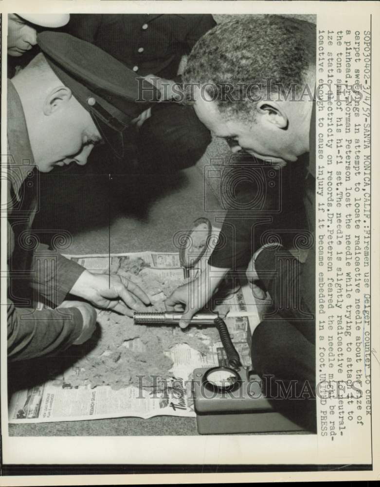 1957 Press Photo Firemen use Geiger counter to search for radioactive needle, CA- Historic Images