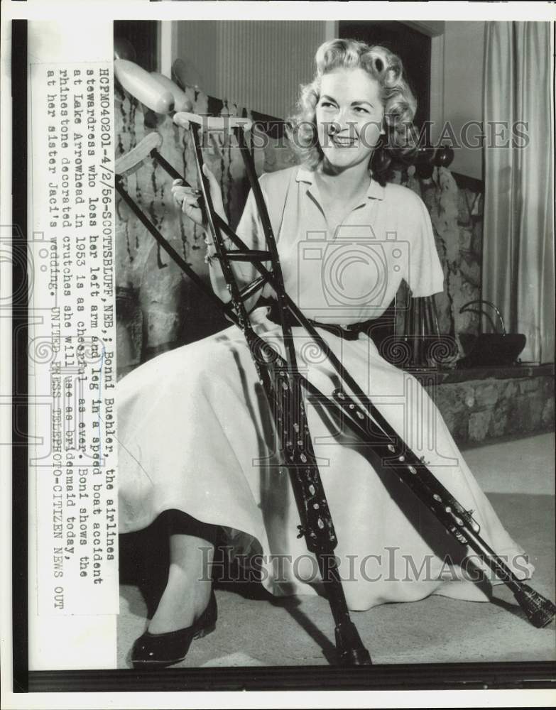 1956 Press Photo Bonni Buehler decorates crutches for sister's wedding, Nebraska- Historic Images