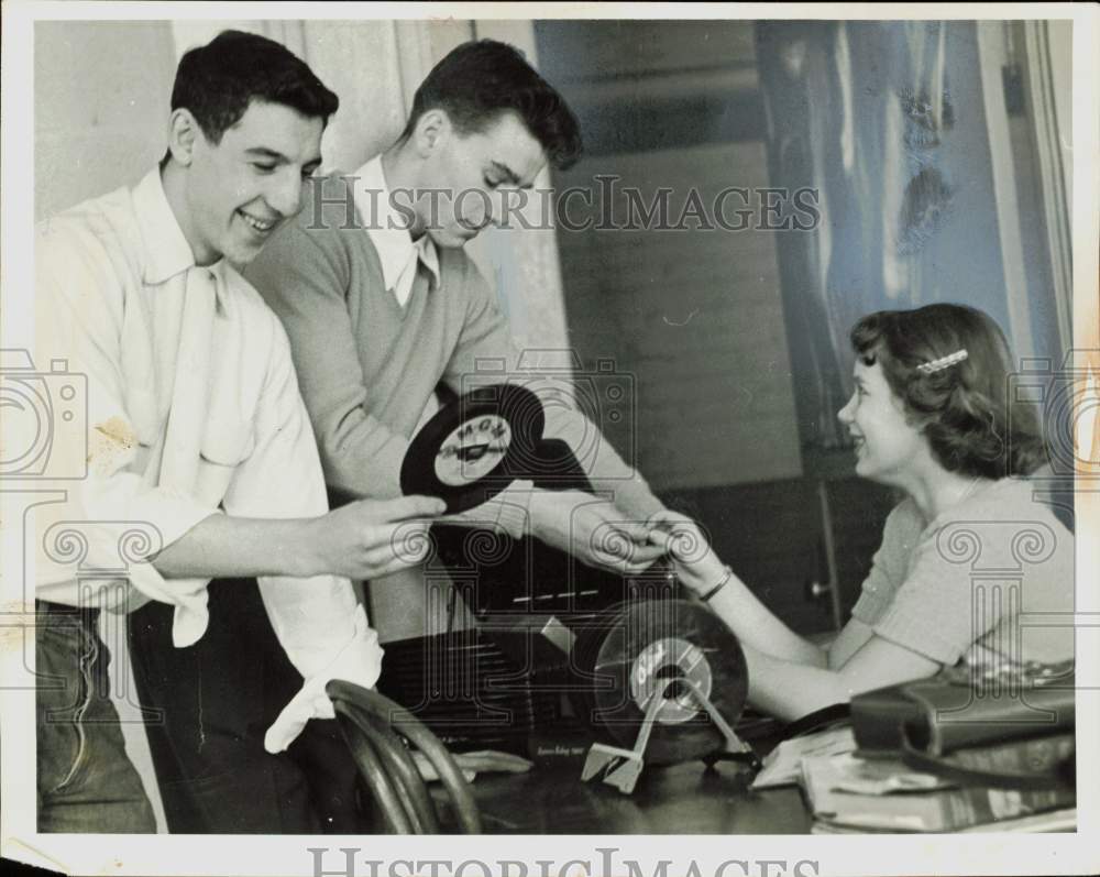 1953 Press Photo Nick Cassisi and classmates checking record albums - nei14606- Historic Images