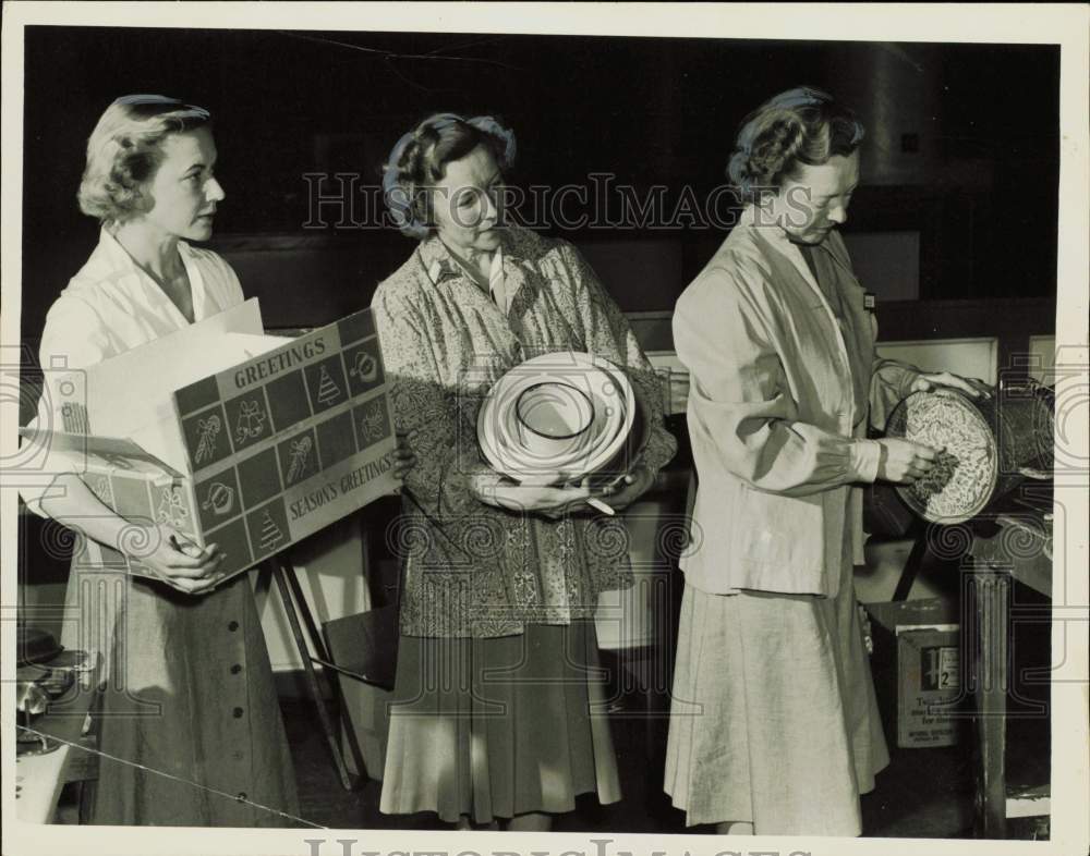 1952 Press Photo Women holding items at the White Elephant Sale - nei15279- Historic Images
