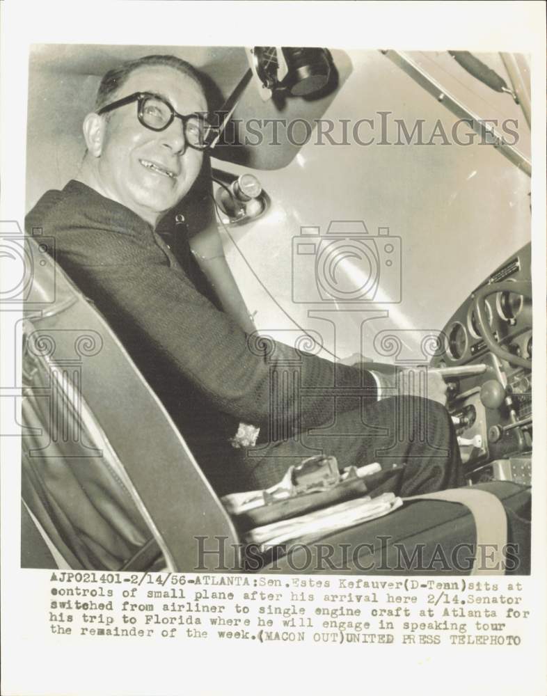 1956 Press Photo Estes Kefauver sits at controls of small plane in Atlanta- Historic Images