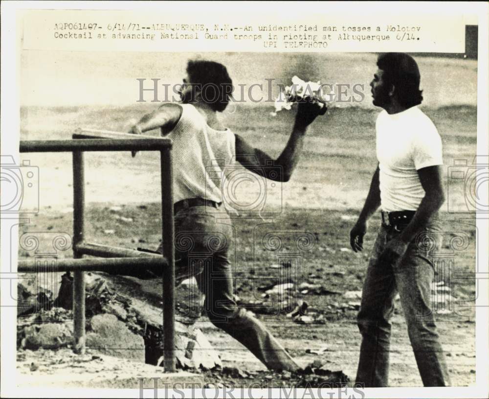 1971 Press Photo A rioter tosses Molotov Cocktail at troops in Albuquerque- Historic Images