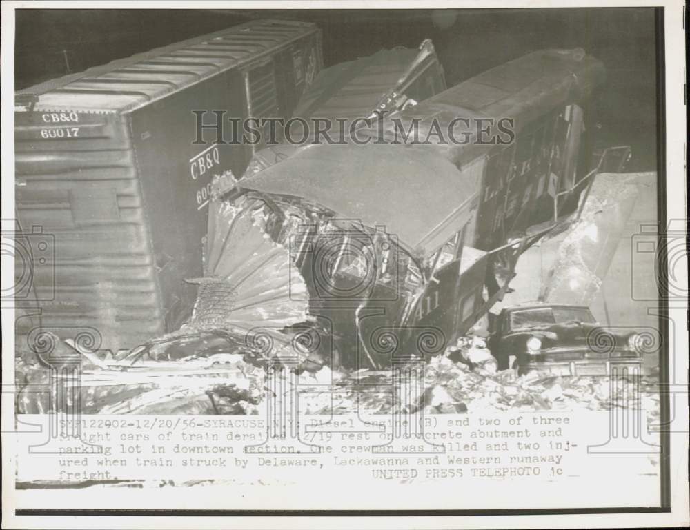 1956 Press Photo Derailed diesel engine &amp; freight cars on concrete abutment, NY- Historic Images