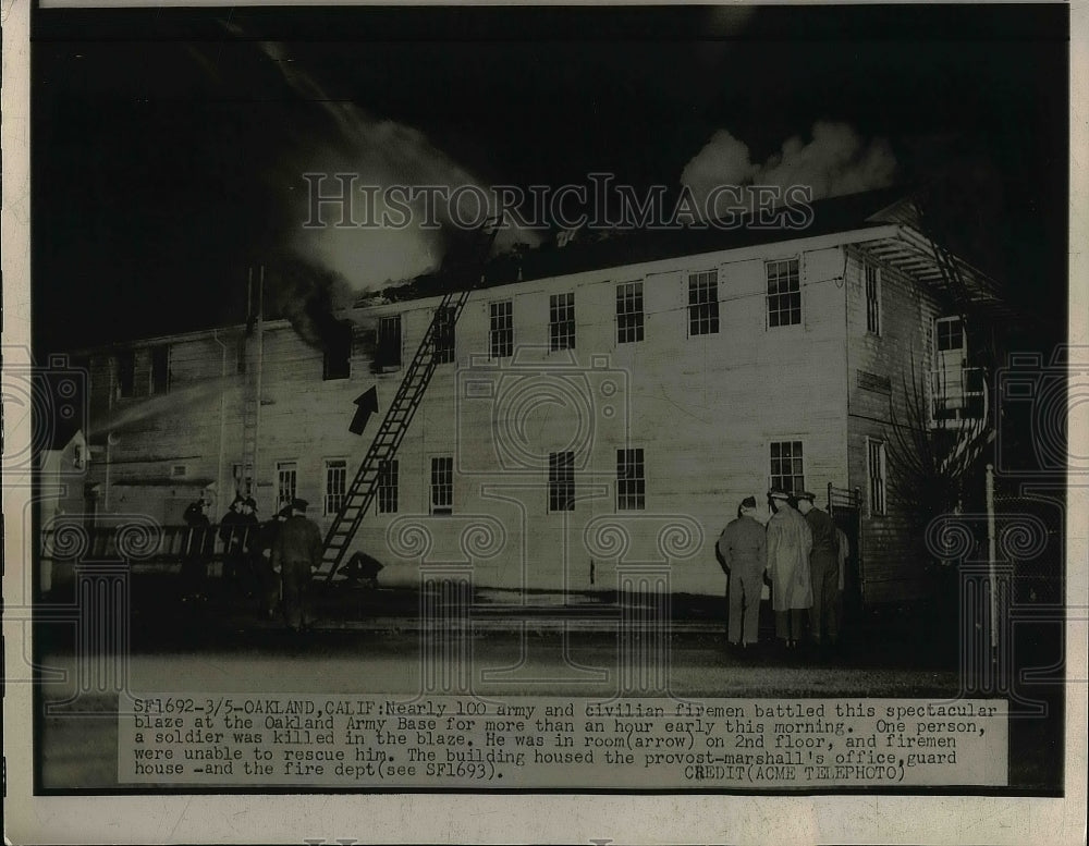 1949 Press Photo Firemen fight blaze at Oakland Army base in Clif. - nem02278