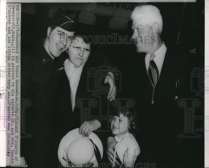 Load image into Gallery viewer, 1958 Press Photo Corp.Vincent D'Andreo greeted by his parents and little sister.
