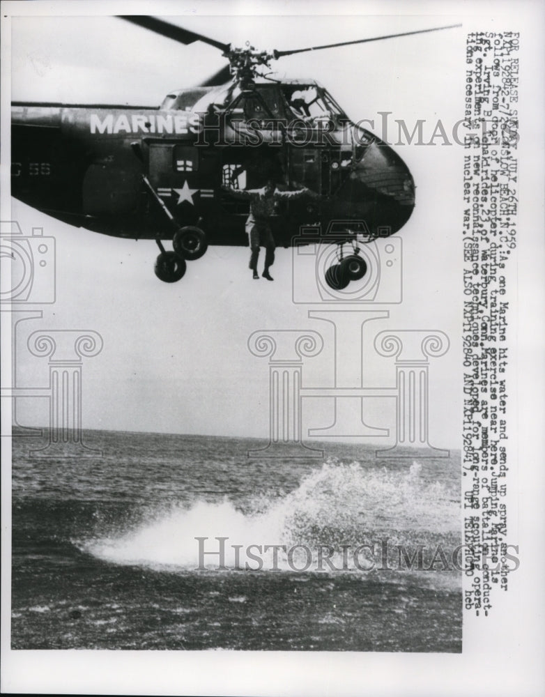 1959 Press Photo Marines jump from copter in training exercise in NC