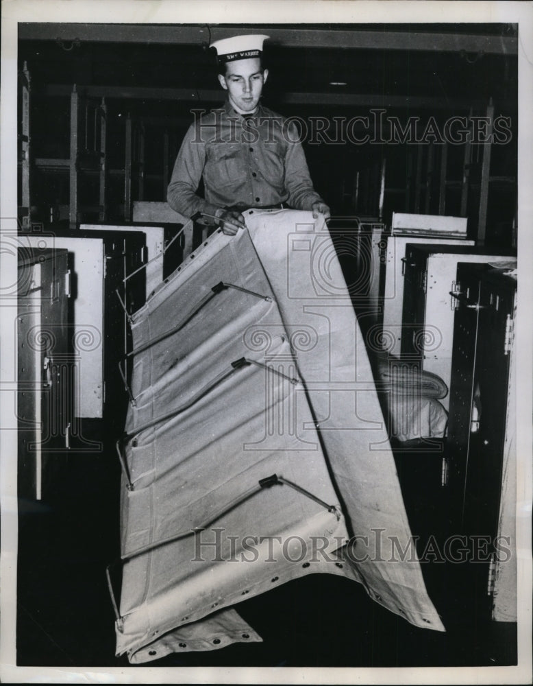 1958 Press Photo British Sailor Hugh Mair Displays Hammock in Portsmouth England- Historic Images