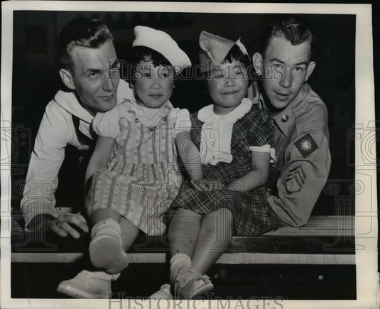 1951 Press Photo Pair of Sendai Misses Attracted by Uniforms & Headgear