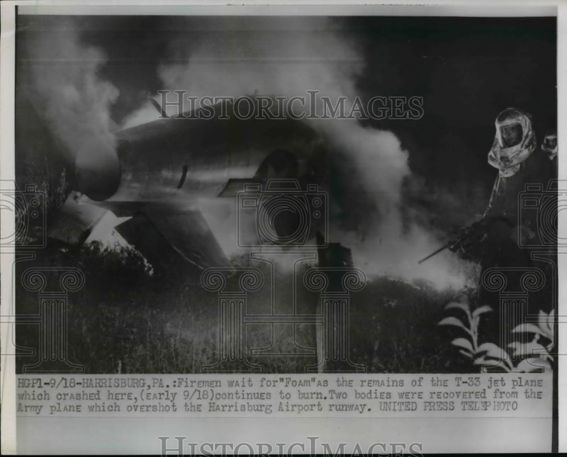 Load image into Gallery viewer, 1954 Press Photo Firemen fight fire in remains of crashed T-33 jet plane
