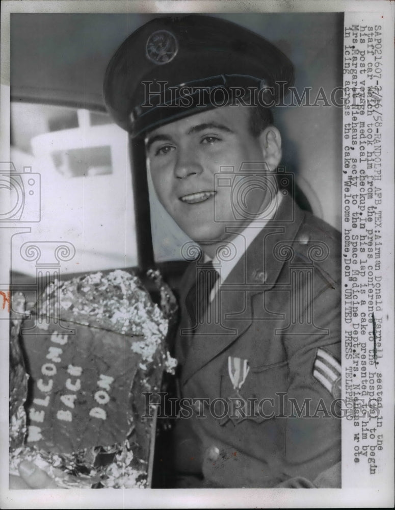 1958 Press Photo Airman Donald Farrell being taken for a medical checkup