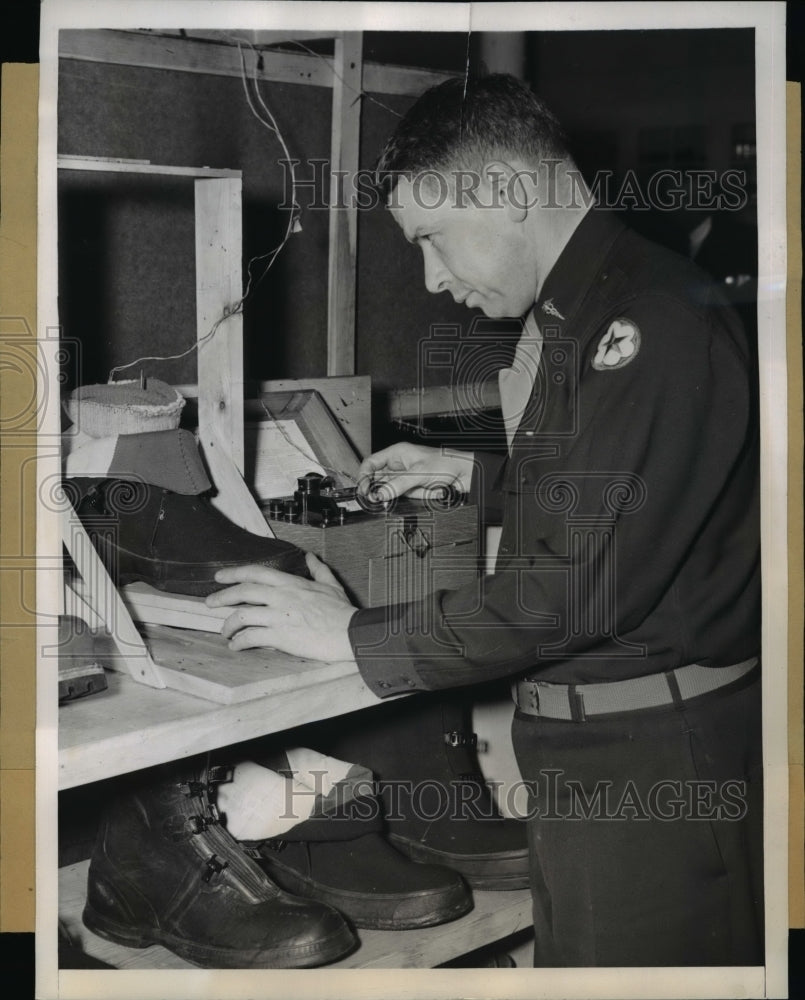 1944 Press Photo Lt Col John H Talbott Tests Army Overshoes Built for Hard Usage