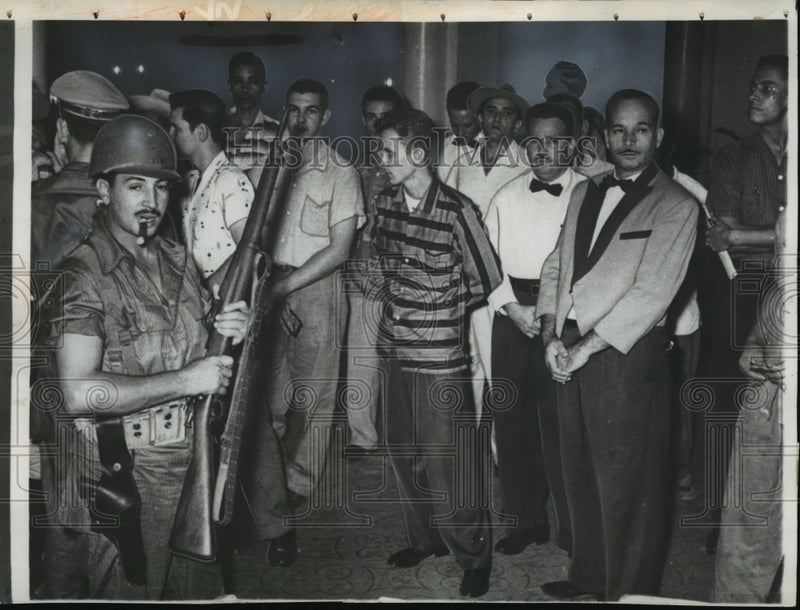 Load image into Gallery viewer, 1956 Press Photo Cuban Armies search guests and workers at Casa Grande Hotel
