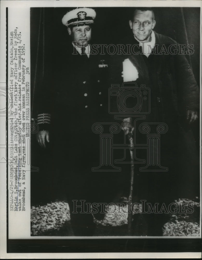 Load image into Gallery viewer, 1953 Press Photo Ensign Broomhead walks out of the tent with a Navy Captain
