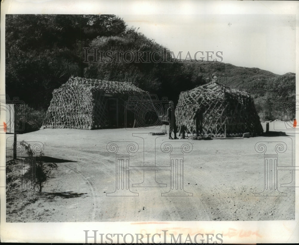 1963 Press Photo Korea Peace Corps Camouflaged huts where they store food