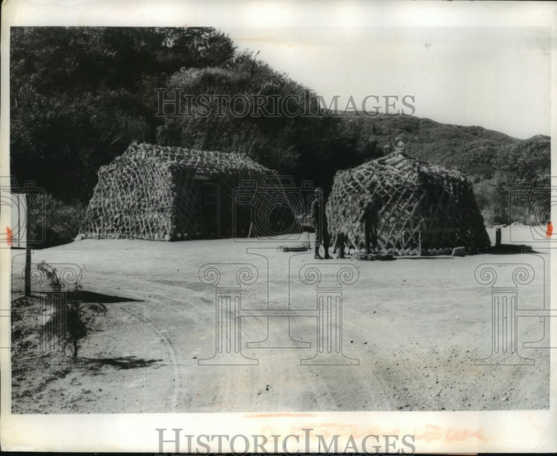 Load image into Gallery viewer, 1963 Press Photo Korea Peace Corps Camouflaged huts where they store food
