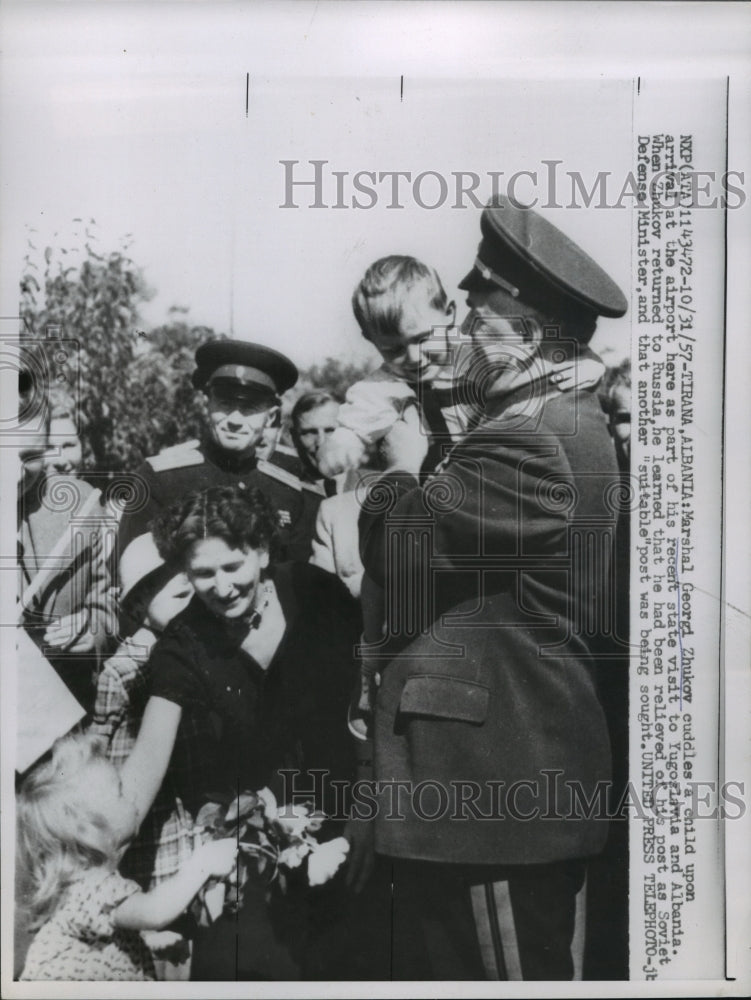 1957 Press Photo Marshal Georgi Zhukov cuddles child during visit to Albania