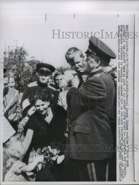1957 Press Photo Marshal Georgi Zhukov cuddles child during visit to Albania